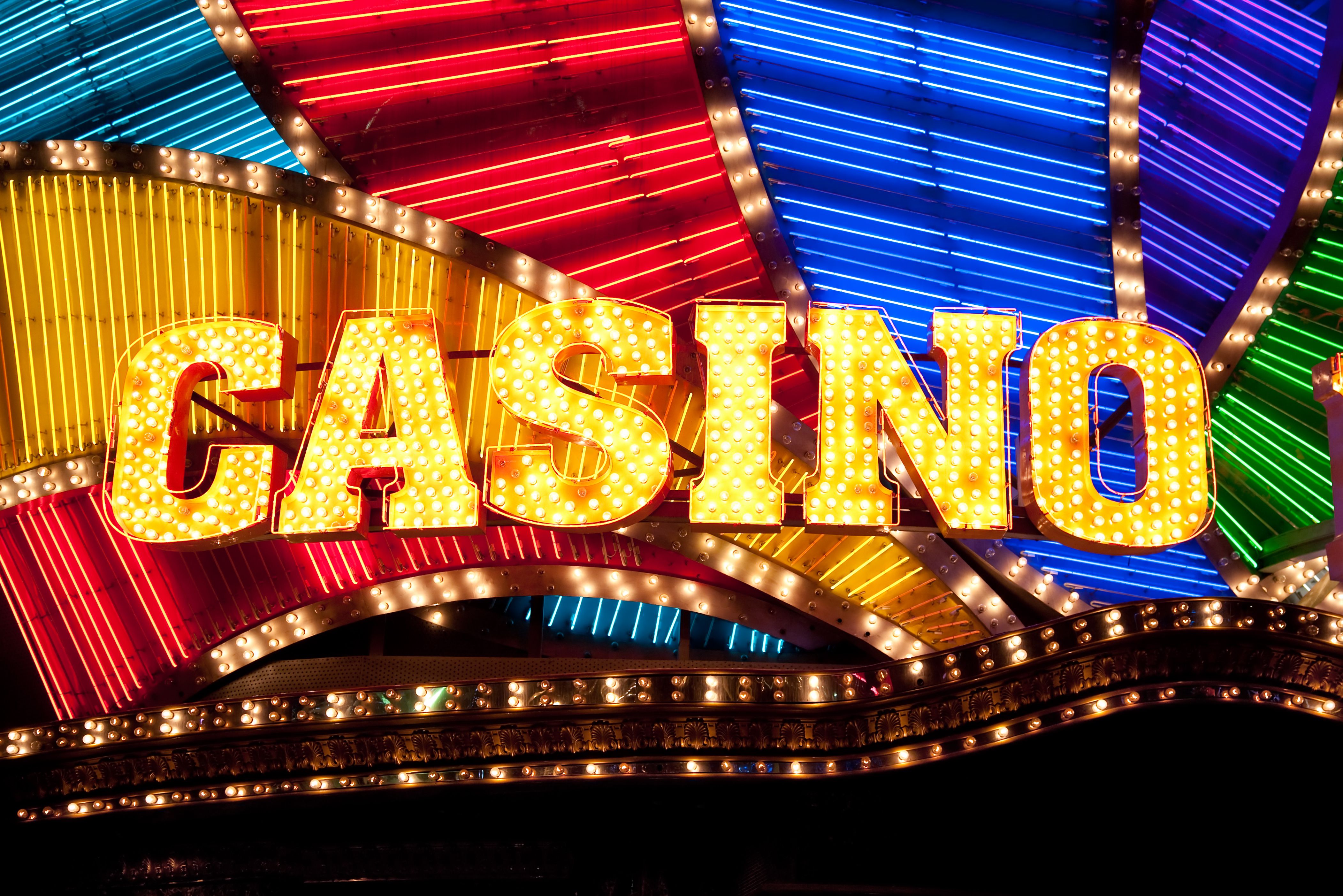 A vibrant graphic showcasing the Lotsa Slots logo and a cascade of gold coins.